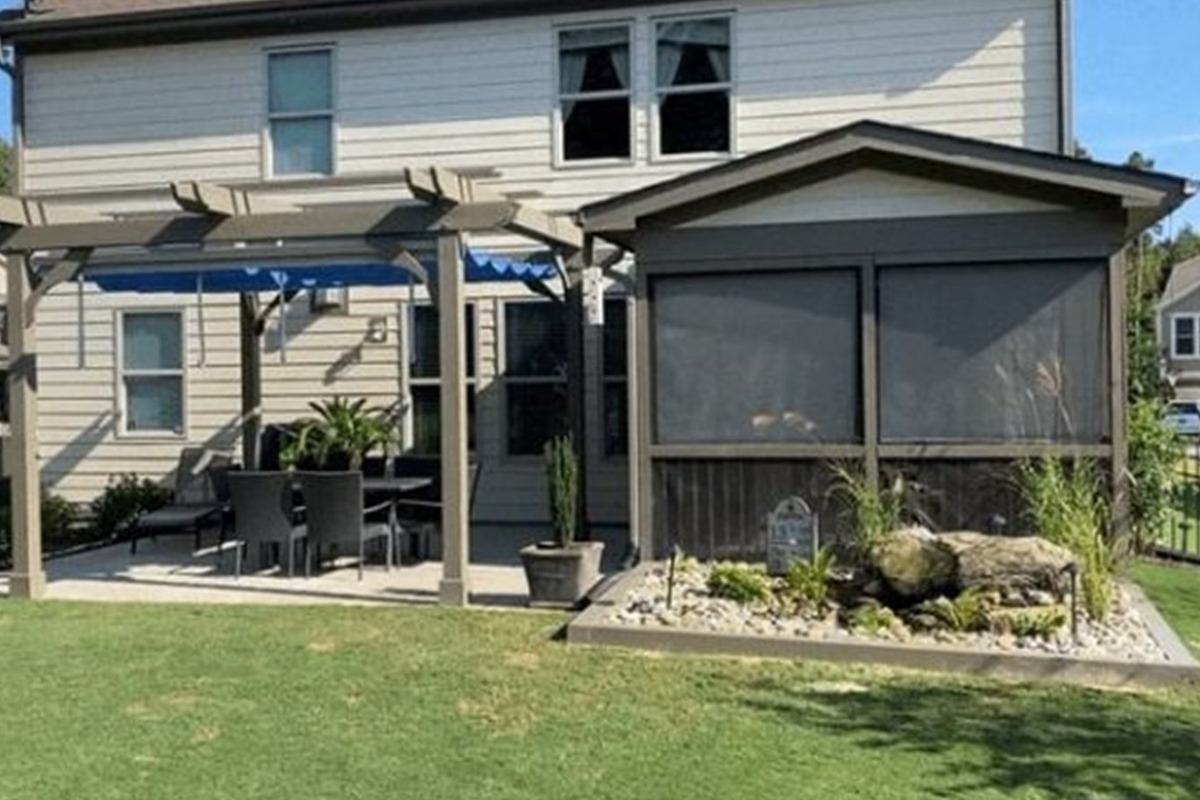Cedar patio cover with stone columns in Lakeway