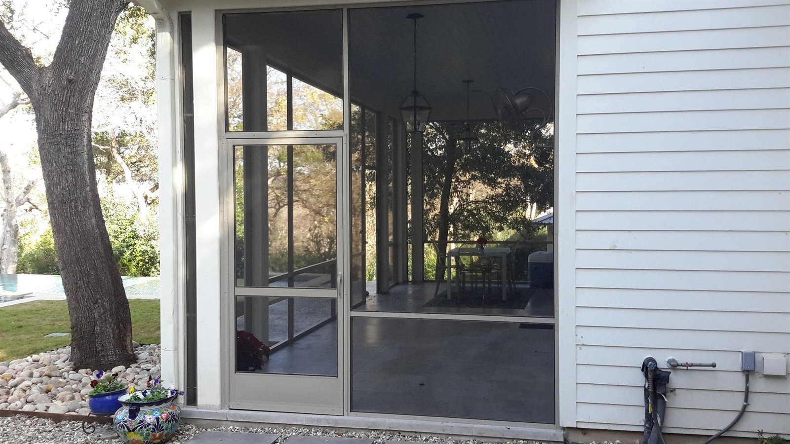 Ceiling fan and recessed lighting being installed on an existing patio cover in Austin