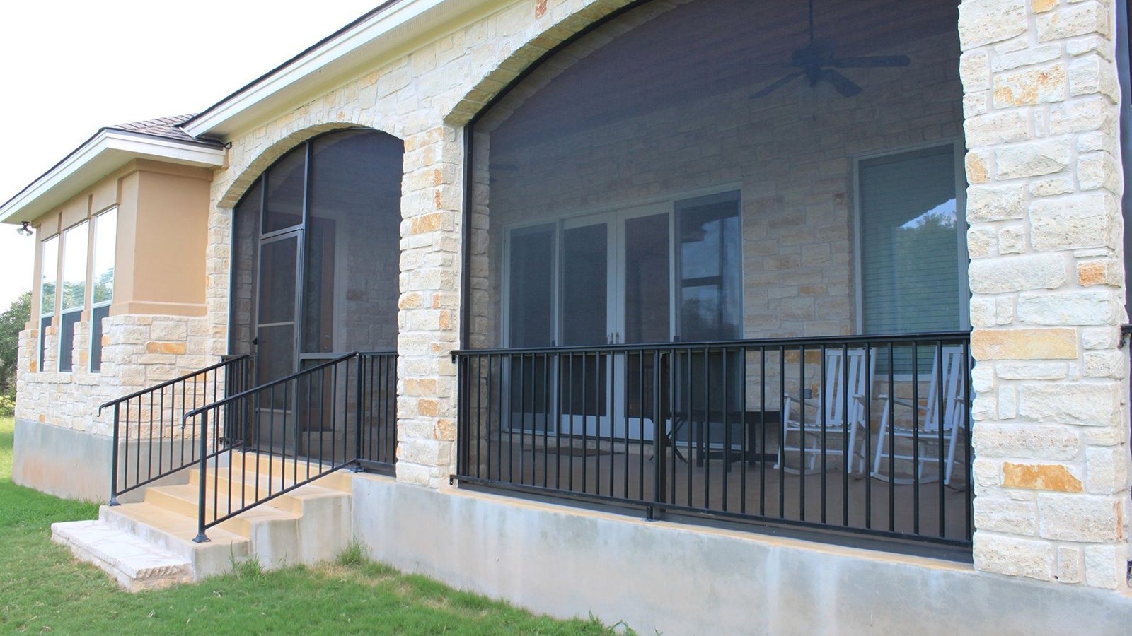 Insulated aluminum patio cover with screens on a Pflugerville home in Falcon Pointe