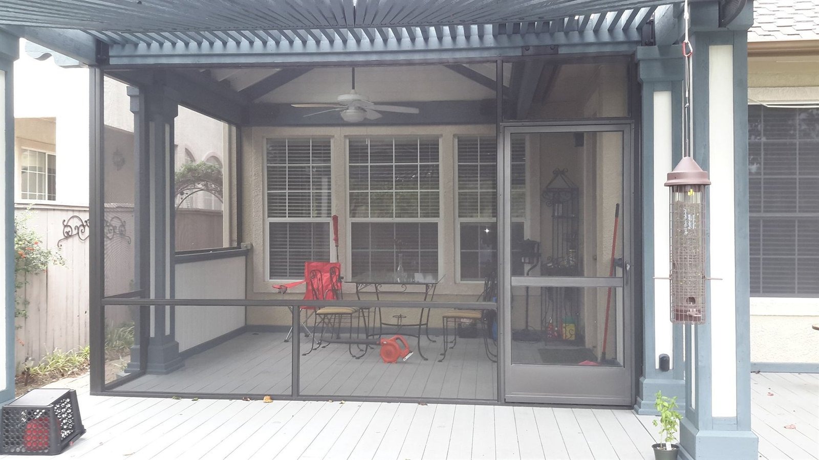 Insulated aluminum patio cover with wood-grain finish, ceiling fans and recessed lights over an Austin patio