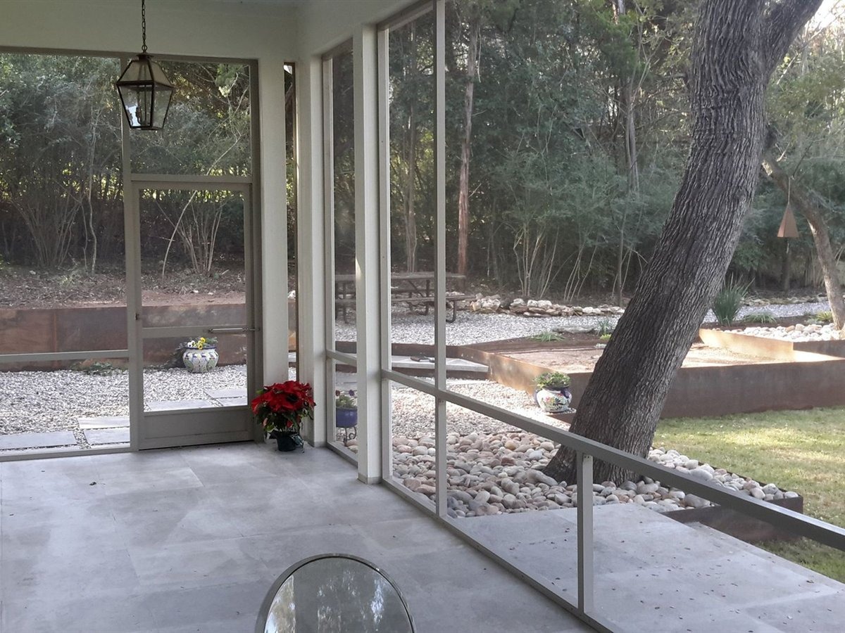 New aluminum patio cover with ceiling fans on a Kyle home in 6 Creeks