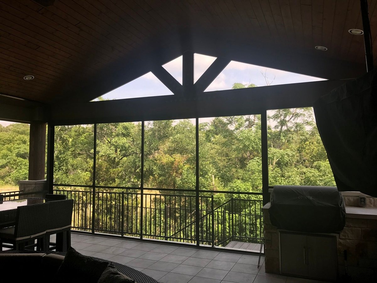 New insulated aluminum patio cover with ceiling fans on a two-story home in Blackhawk, Pflugerville