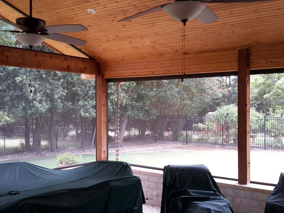 Stamped concrete patio with a stone border and post footings for a patio cover