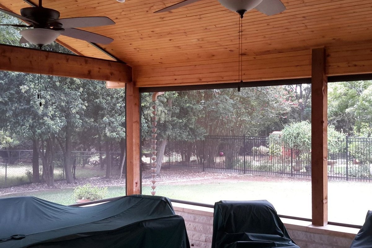 Wood pergola over outdoor kitchen in Cedar Park